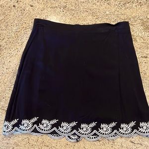 Francesca black with embroidered white floral hemline. Size L.